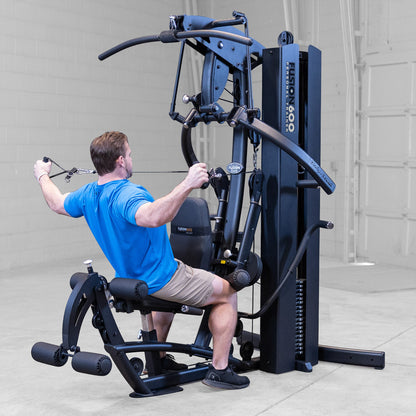 Body-Solid FUSION 600 Bi-Angular Gym with Functional Trainer Arms exercises on white background