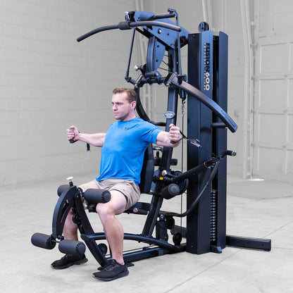 Body-Solid FUSION 600 Bi-Angular Gym with Functional Trainer Arms exercises on white background