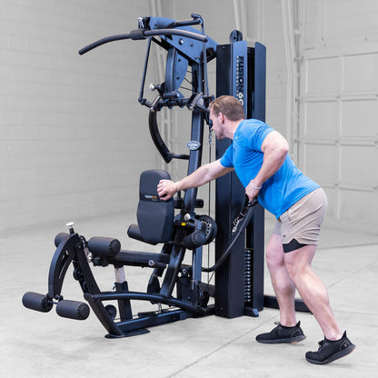 Body-Solid FUSION 600 Bi-Angular Gym with Functional Trainer Arms exercises on white background