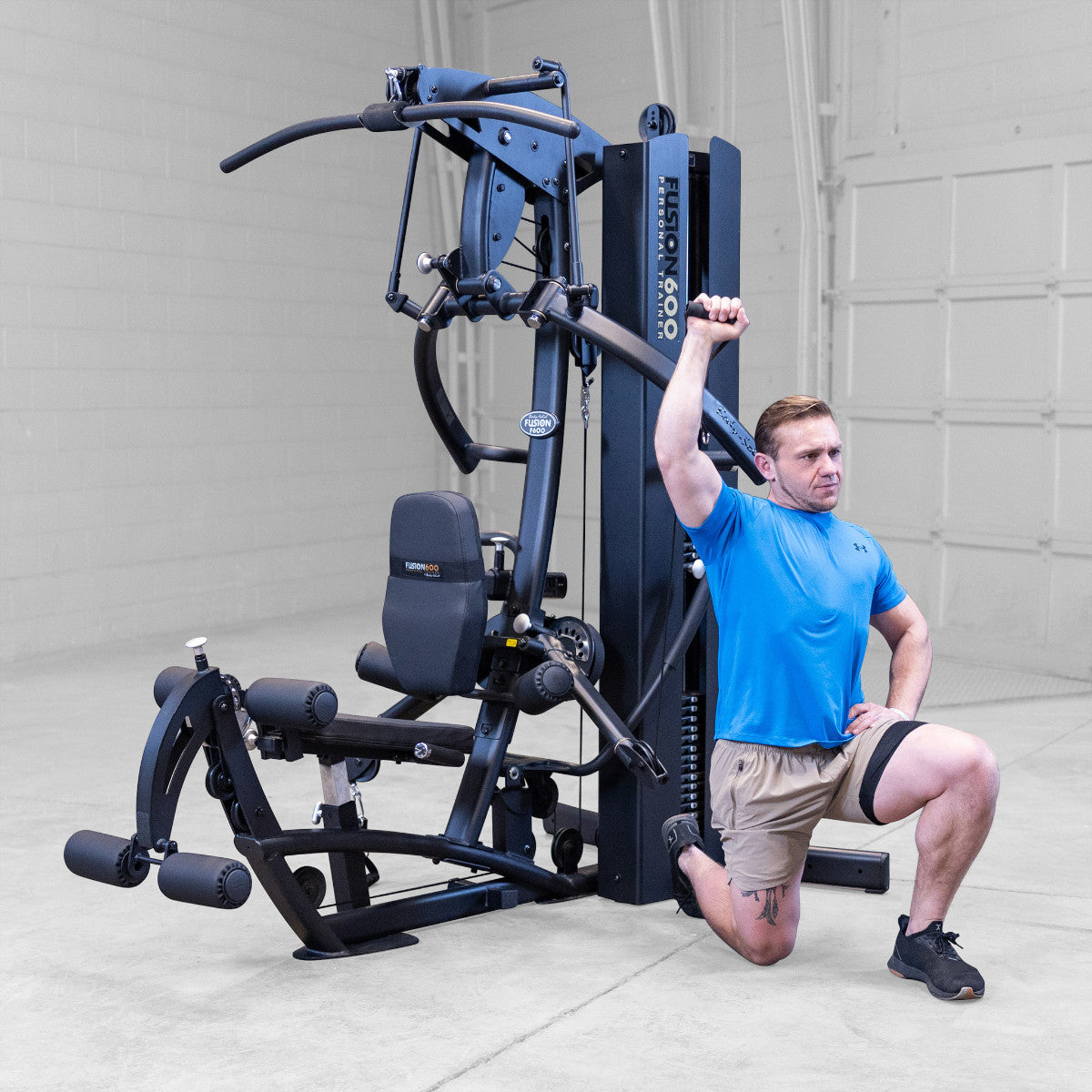Body-Solid FUSION 600 Bi-Angular Gym with Functional Trainer Arms exercises on white background