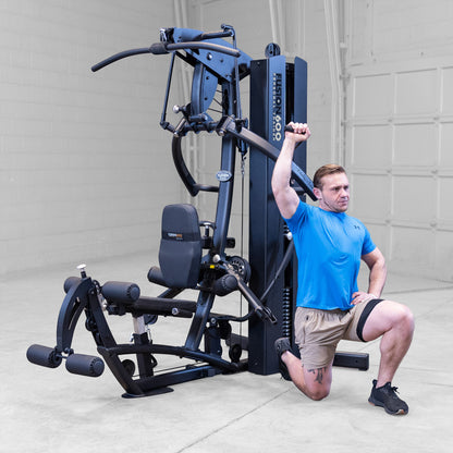 Body-Solid FUSION 600 Bi-Angular Gym with Functional Trainer Arms exercises on white background