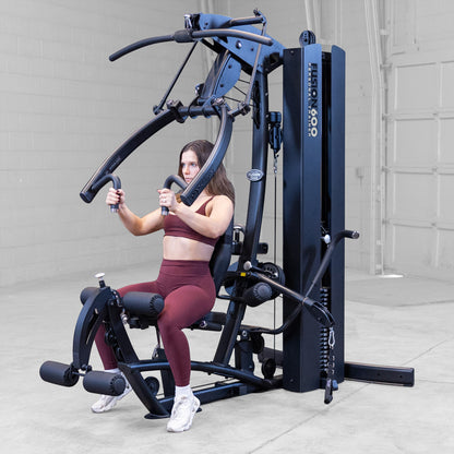 Body-Solid FUSION 600 Bi-Angular Gym with Functional Trainer Arms exercises on white background