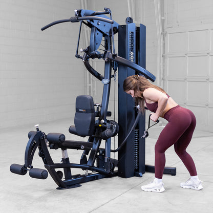 Body-Solid FUSION 600 Bi-Angular Gym with Functional Trainer Arms exercises on white background