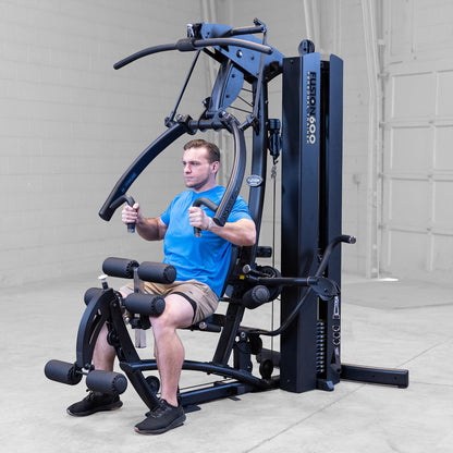 Body-Solid FUSION 600 Bi-Angular Gym with Functional Trainer Arms exercises on white background