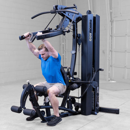 Body-Solid FUSION 600 Bi-Angular Gym with Functional Trainer Arms exercises on white background