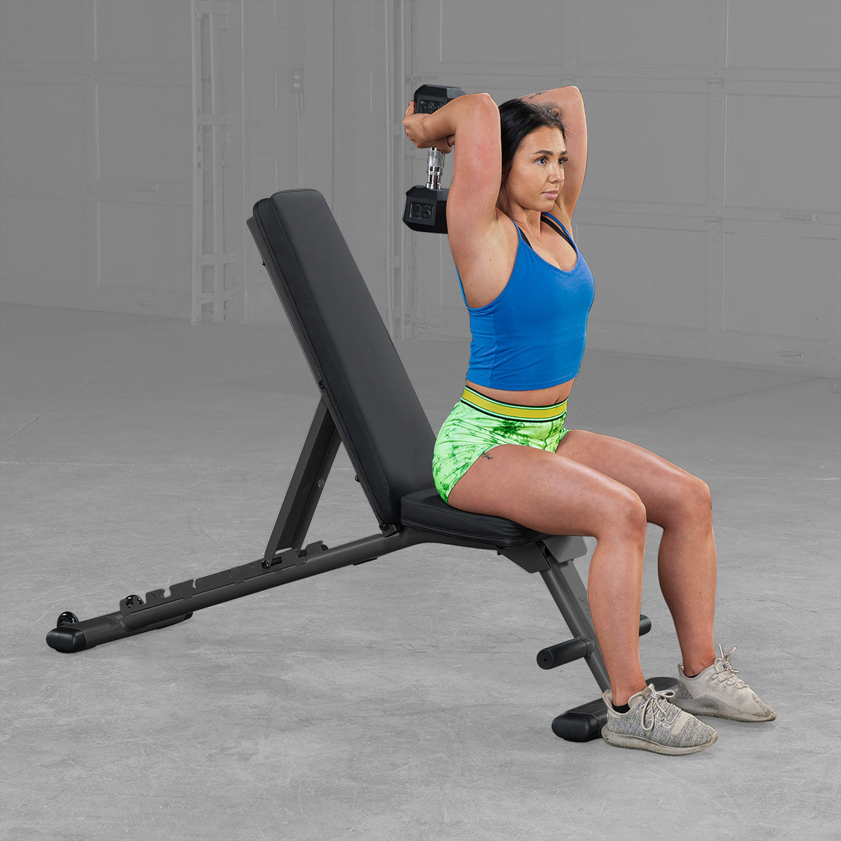 Body-Solid GFID225B Commercial Folding FID Weight Bench woman exercising