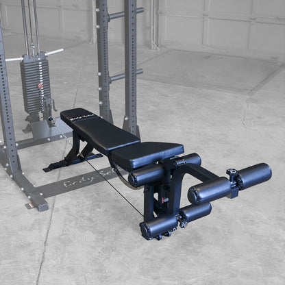 Body-Solid GLEG Leg Ext and Leg Curl Bench Attachment connected to rack plate stack
