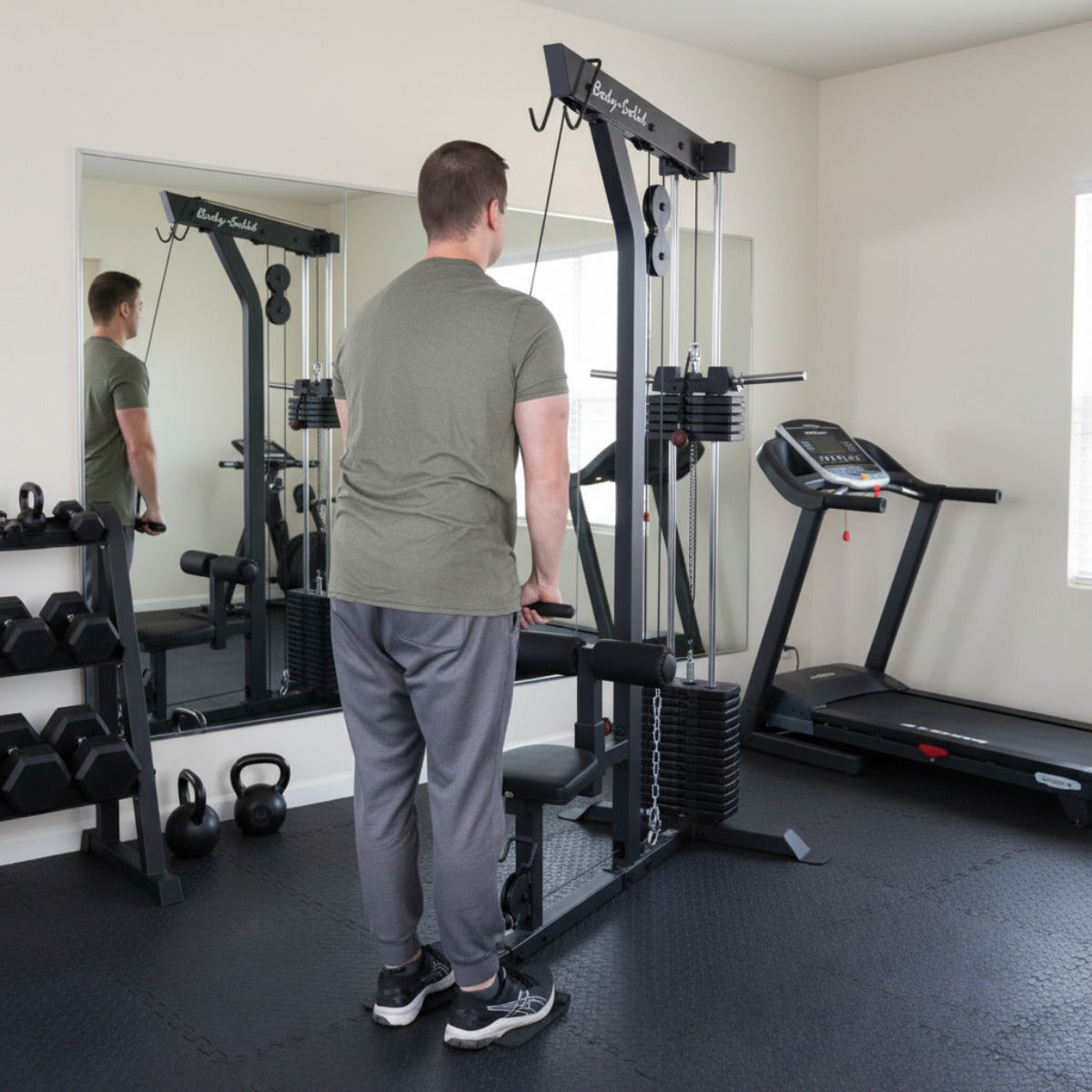 Body-Solid GLM85B Lat Machine man exercising in gym
