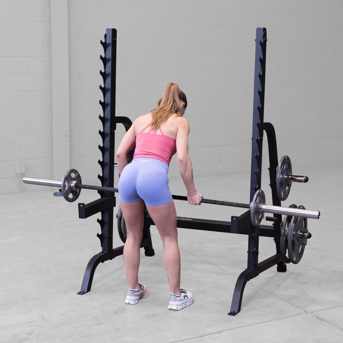 Body-Solid GPR370B Olympic Multi Press Rack woman exercising