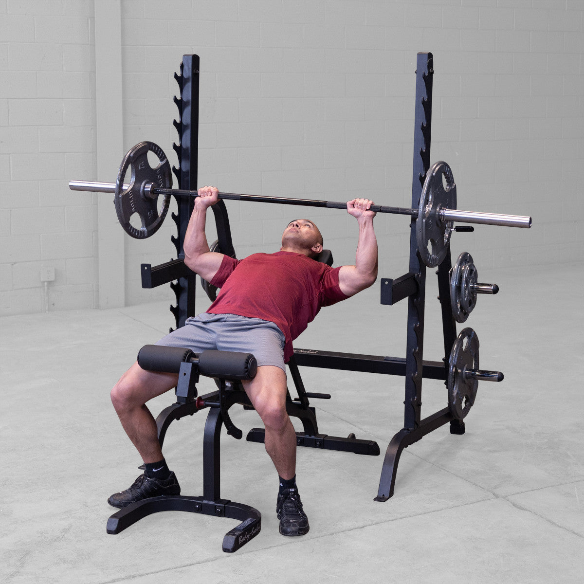 Body-Solid GPR370B Olympic Multi Press Rack man exercising