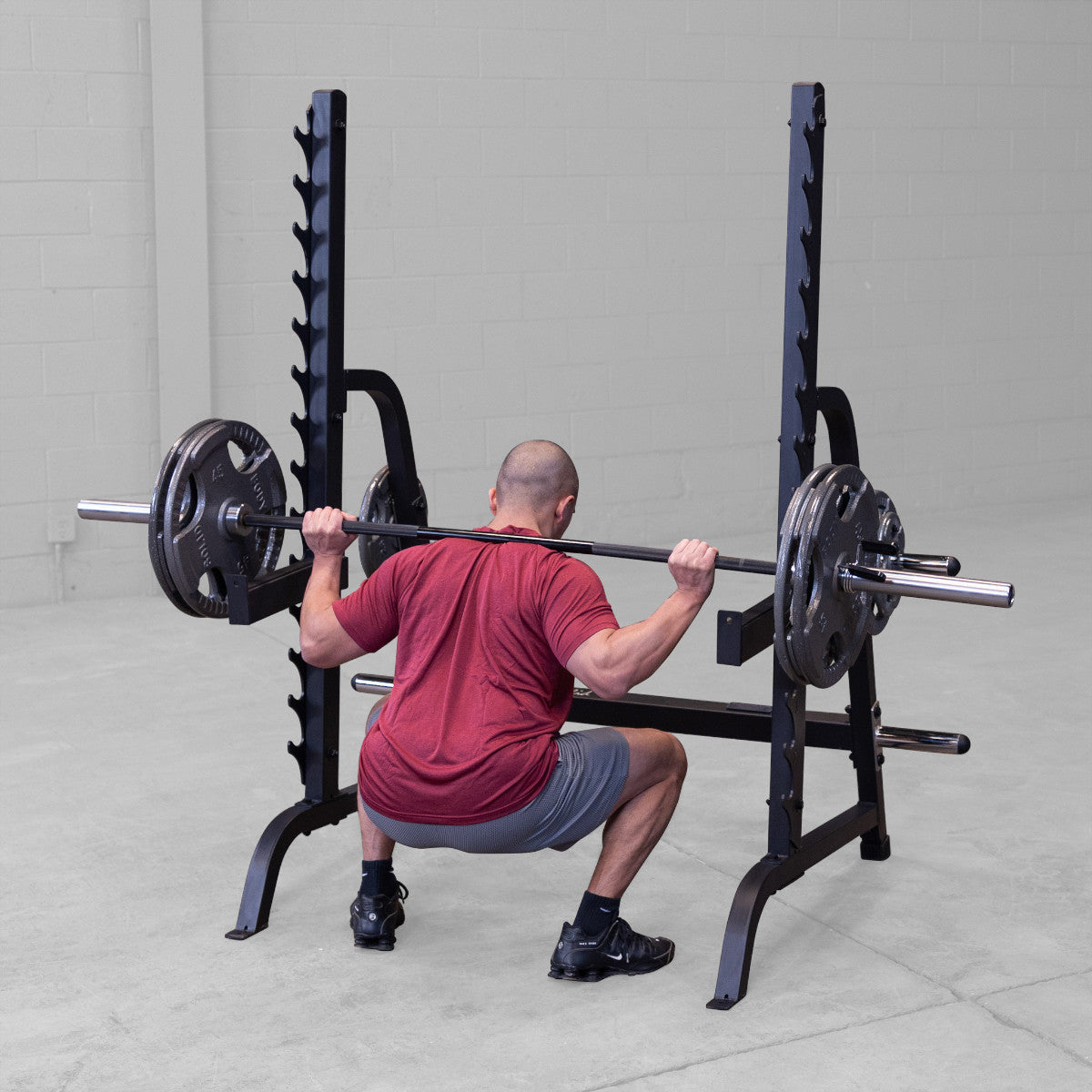 Body-Solid GPR370B Olympic Multi Press Rack man exercising