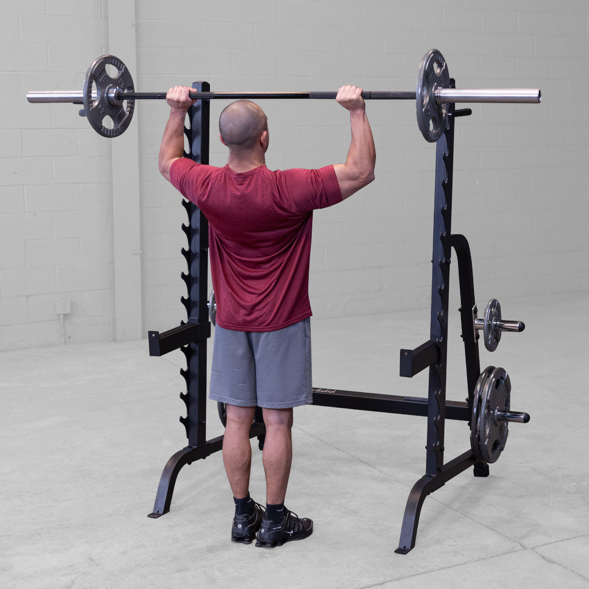 Body-Solid GPR370B Olympic Multi Press Rack man exercising