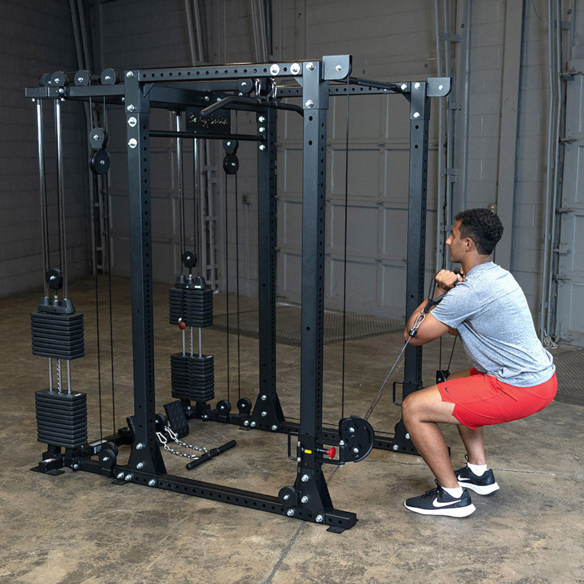 Body-Solid GPR400 Heavy Duty Power Rack Functional Trainer Option man exercising