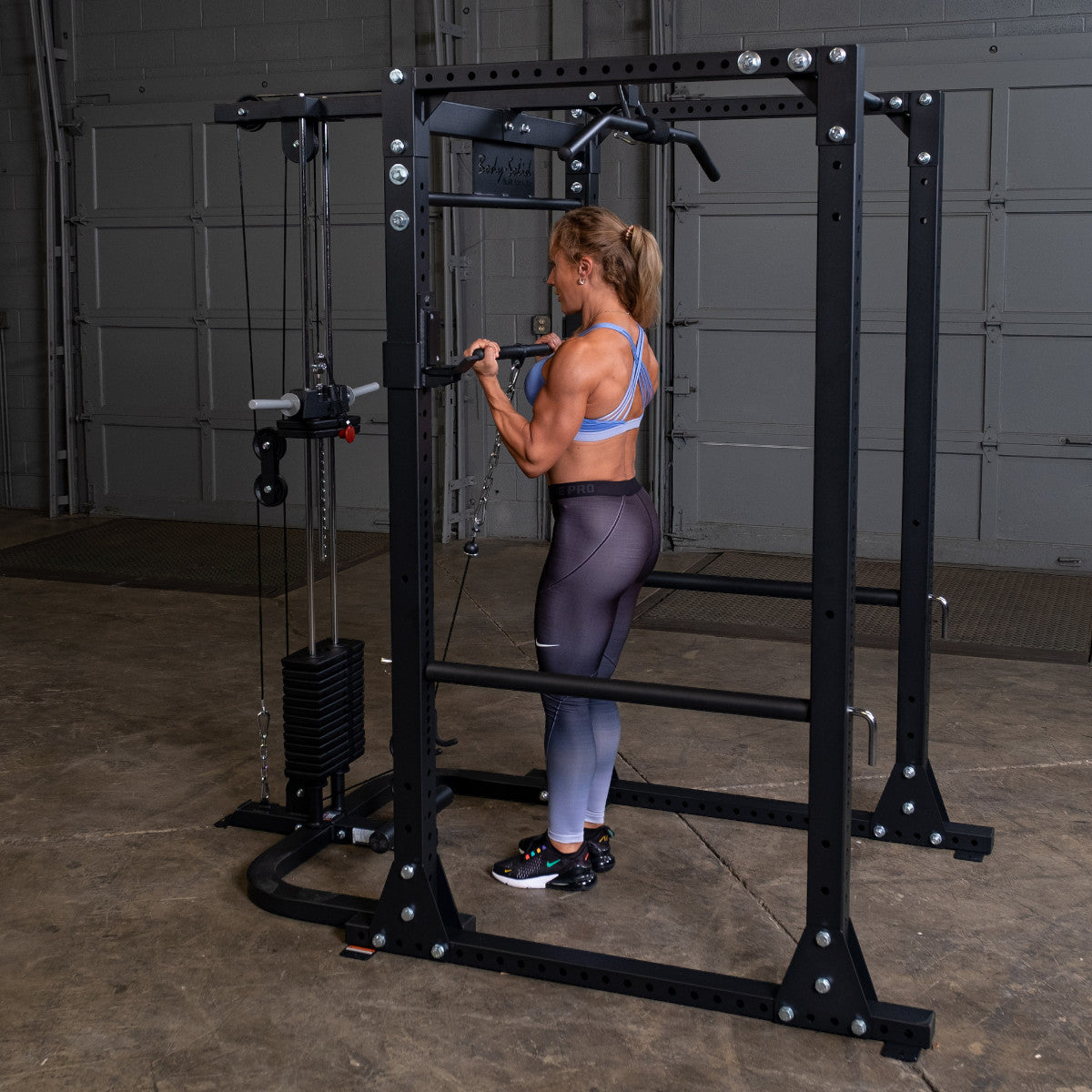 Body-Solid GPR400 Heavy Duty Power Rack woman exercising