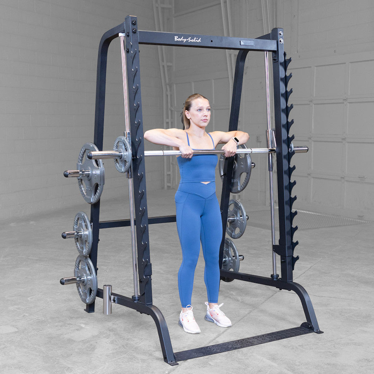 Body-Solid GS348B Series 7 Smith Machine woman exercising