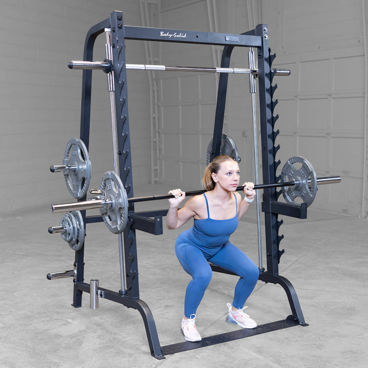 Body-Solid GS348B Series 7 Smith Machine woman exercising