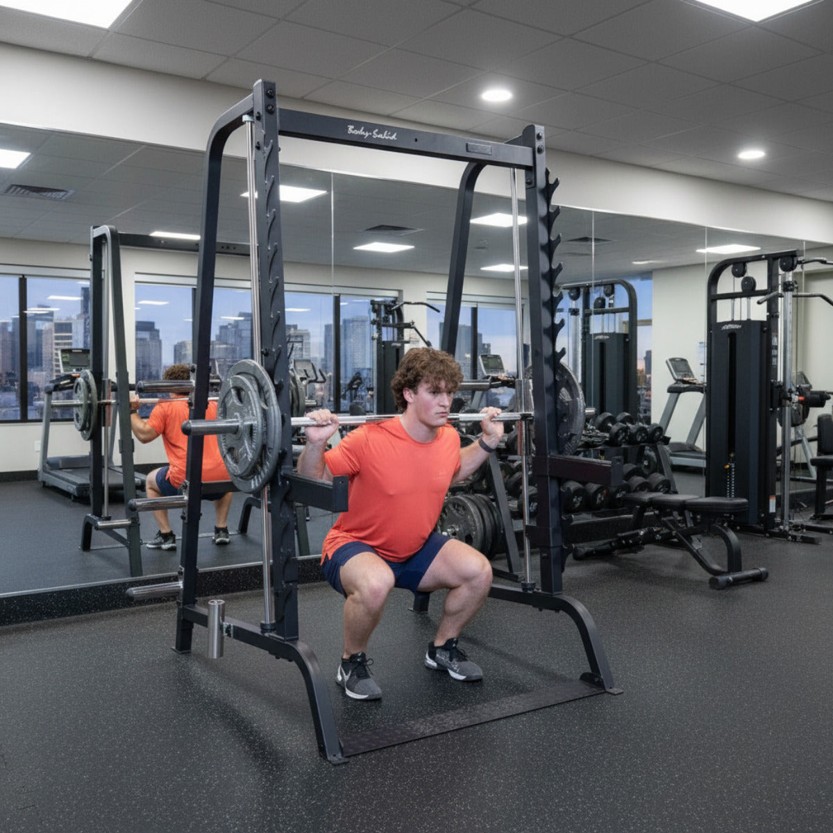 Body-Solid GS348B Series 7 Smith Machine man exercising