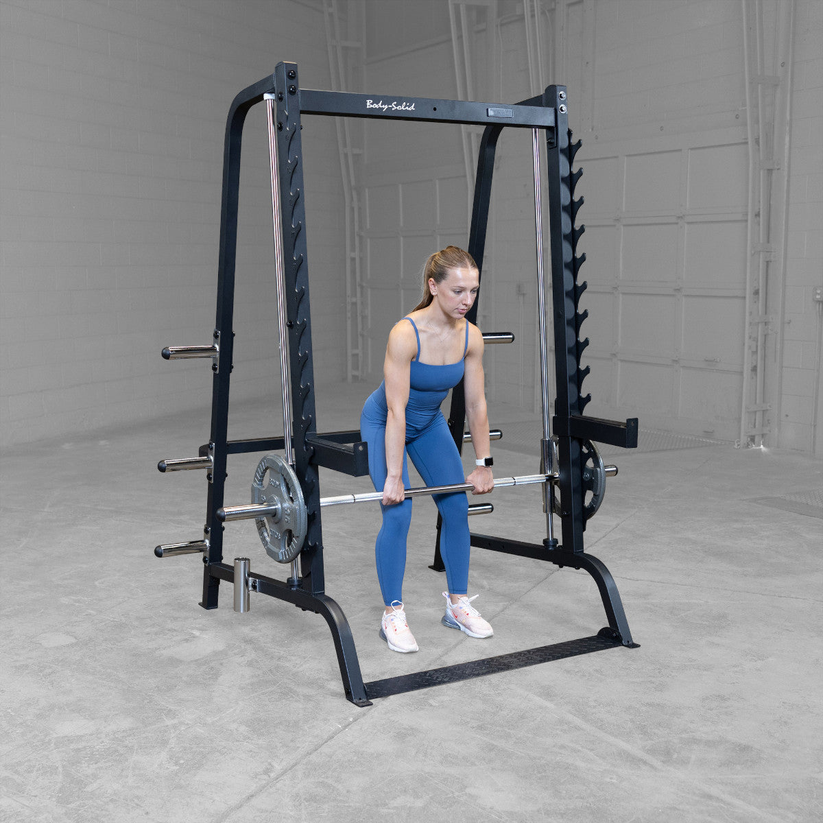 Body-Solid GS348B Series 7 Smith Machine woman exercising