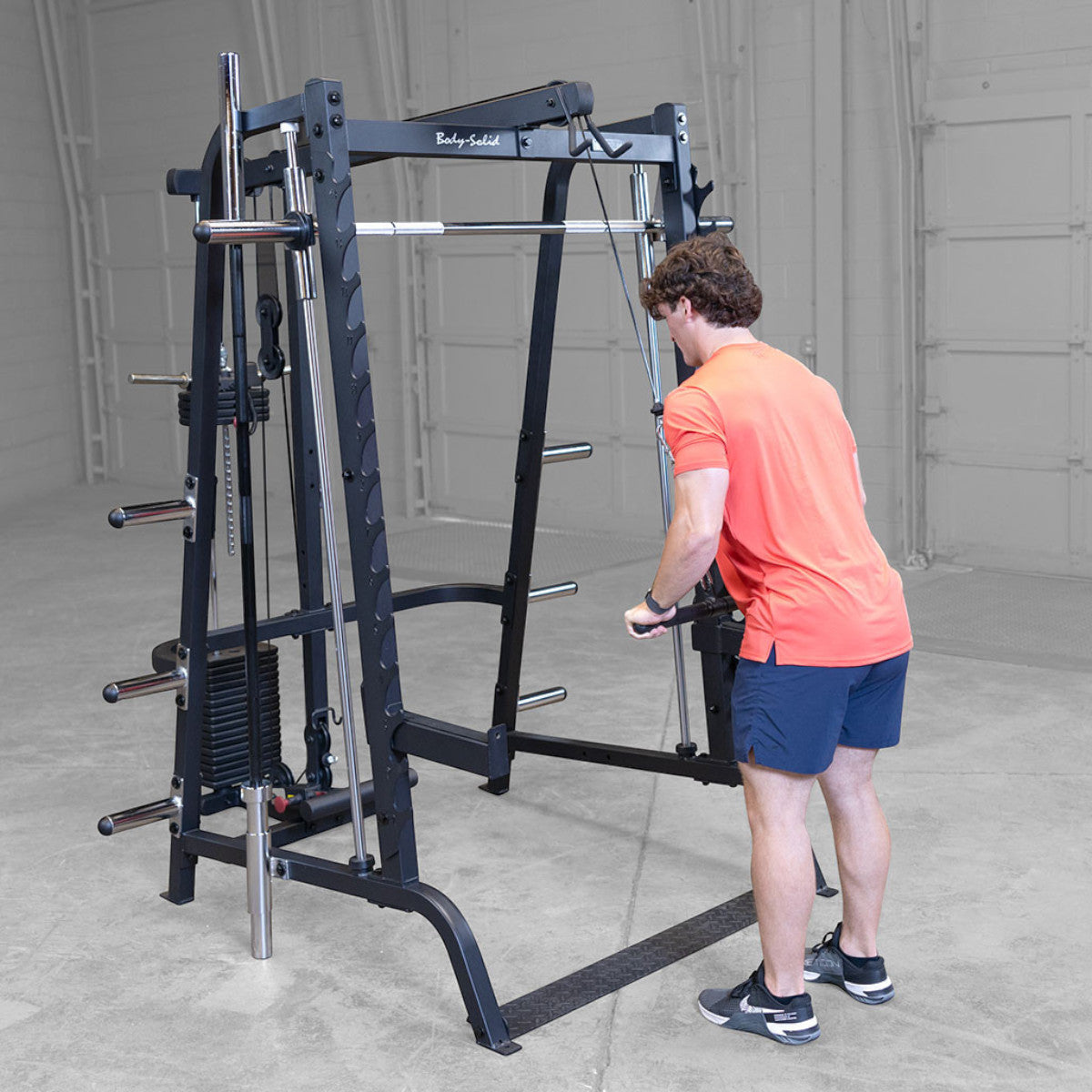 Body-Solid GS348BP4 Series 7 Smith Gym Package man exercising