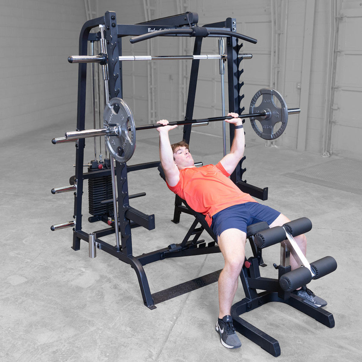 Body-Solid GS348BP4 Series 7 Smith Gym Package man exercising