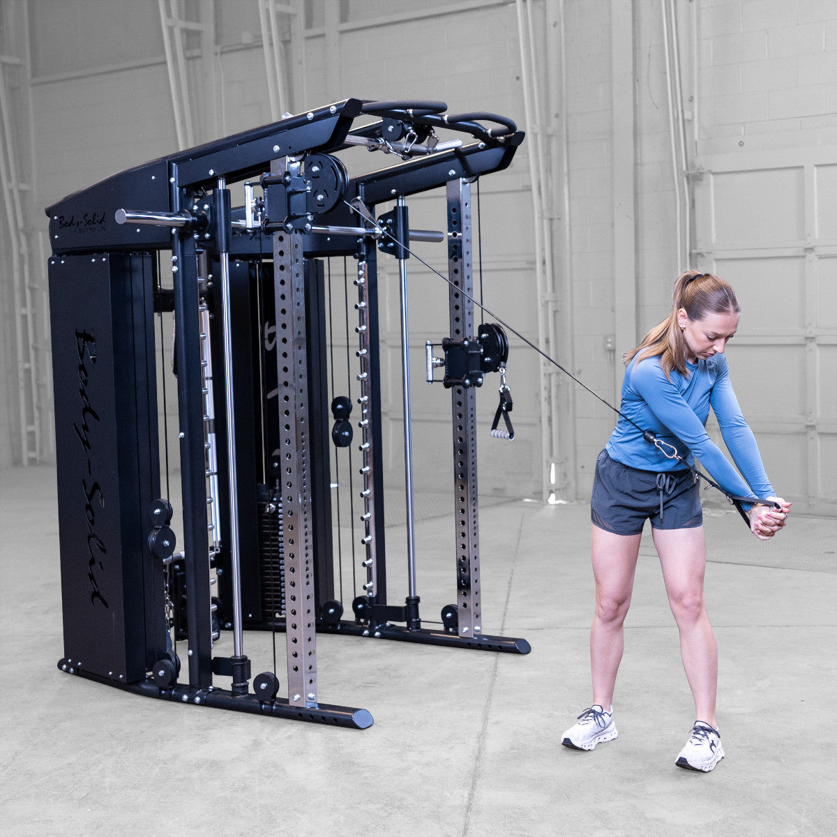 Body-Solid GFSR100 All-in-One Smith Machine / Functional Trainer woman exercising