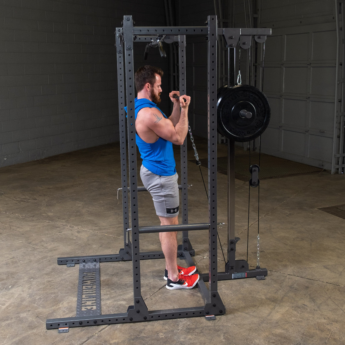 Body-Solid Powerline PPR500 Half Rack with man exercising