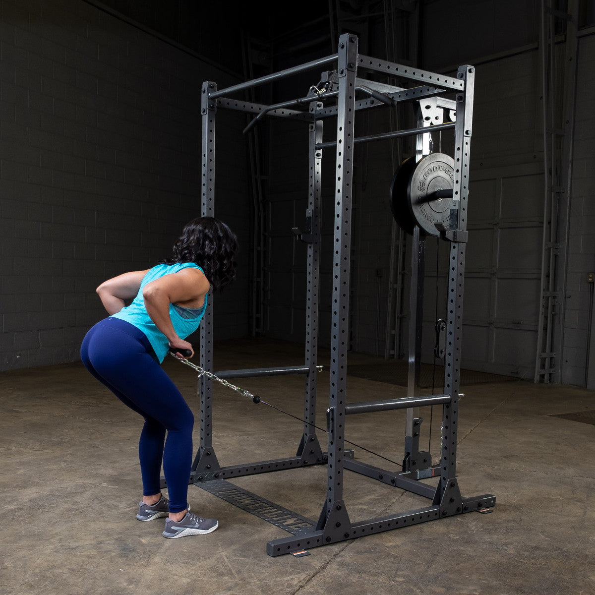 Body-Solid Powerline PPR1000 Power Rack with PLA1000 Lat Attachment woman exercising