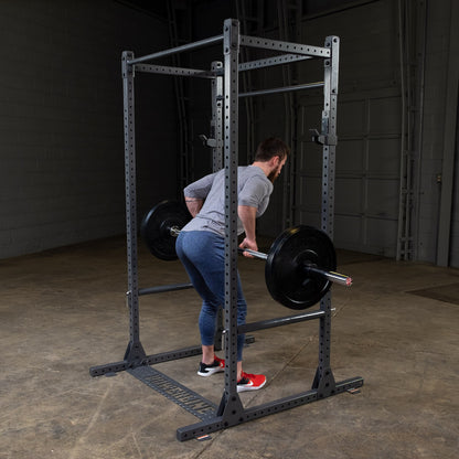 Body-Solid Powerline PPR1000 Power Rack with man exercising