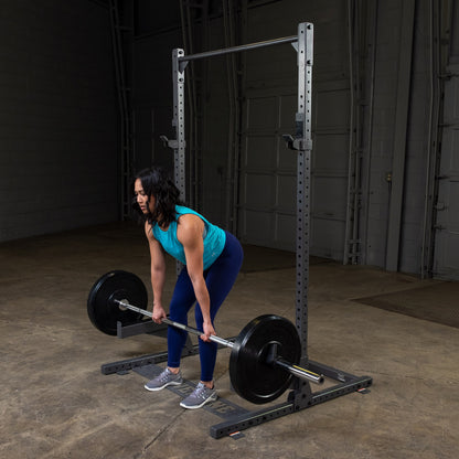 Body-Solid Powerline PPR500 Half Rack with woman exercising