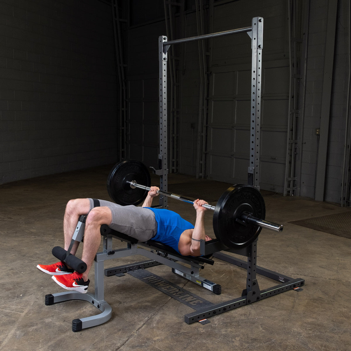 Body-Solid Powerline PPR500 Half Rack with man exercising