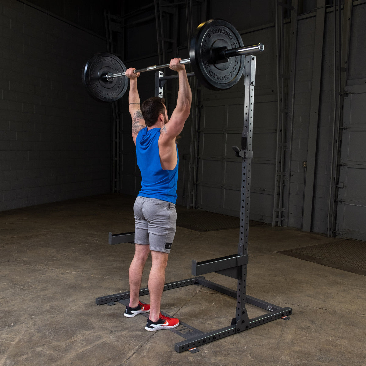 Body-Solid Powerline PPR500 Half Rack with man exercising