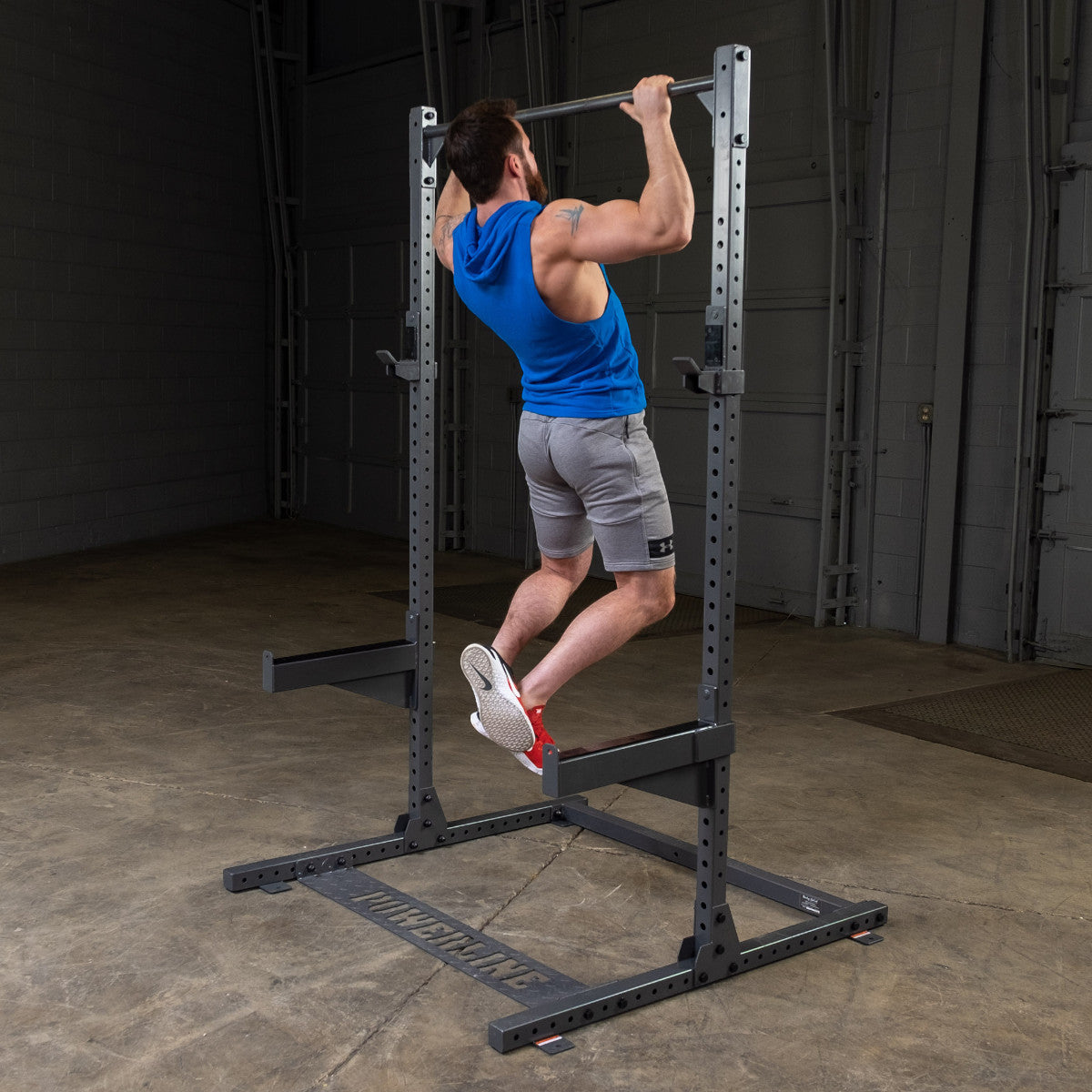 Body-Solid Powerline PPR500 Half Rack with man exercising