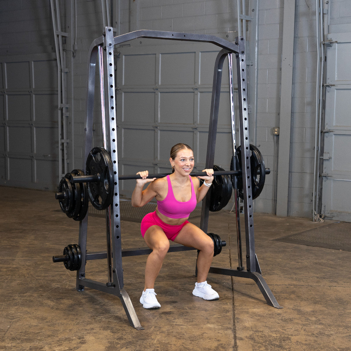 Body-Solid Powerline PSM200 Smith Machine woman exercising