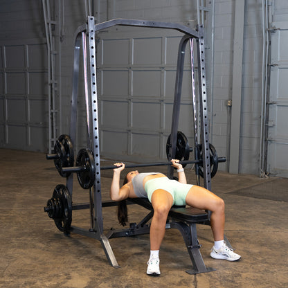 Body-Solid Powerline PSM200 Smith Machine woman exercising