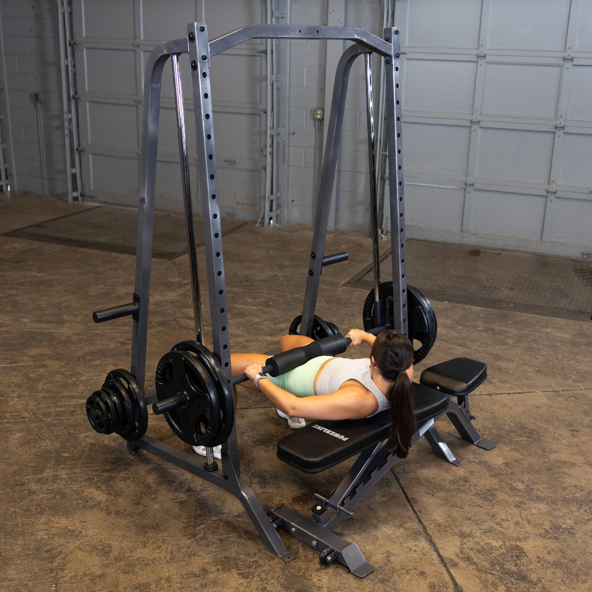 Body-Solid Powerline PSM200 Smith Machine woman exercising