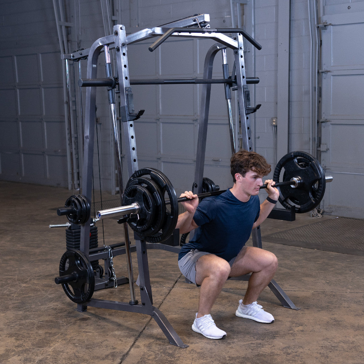 Body-Solid Powerline PSM200 Smith Machine man exercising