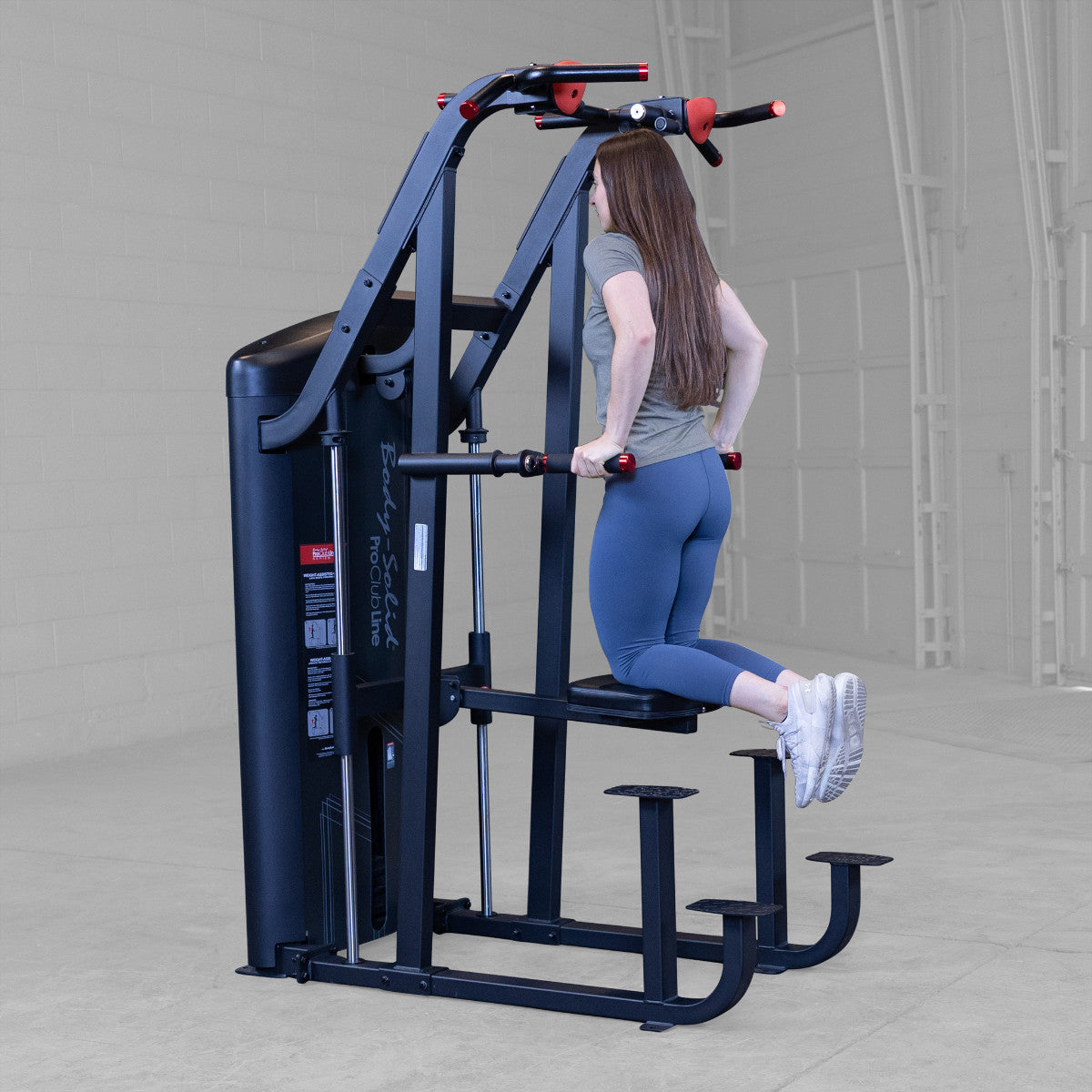 Body-Solid S2ACDX/2 Pro ClubLine Series 2 Weight Assisted Chin & Dip Machine woman exercising