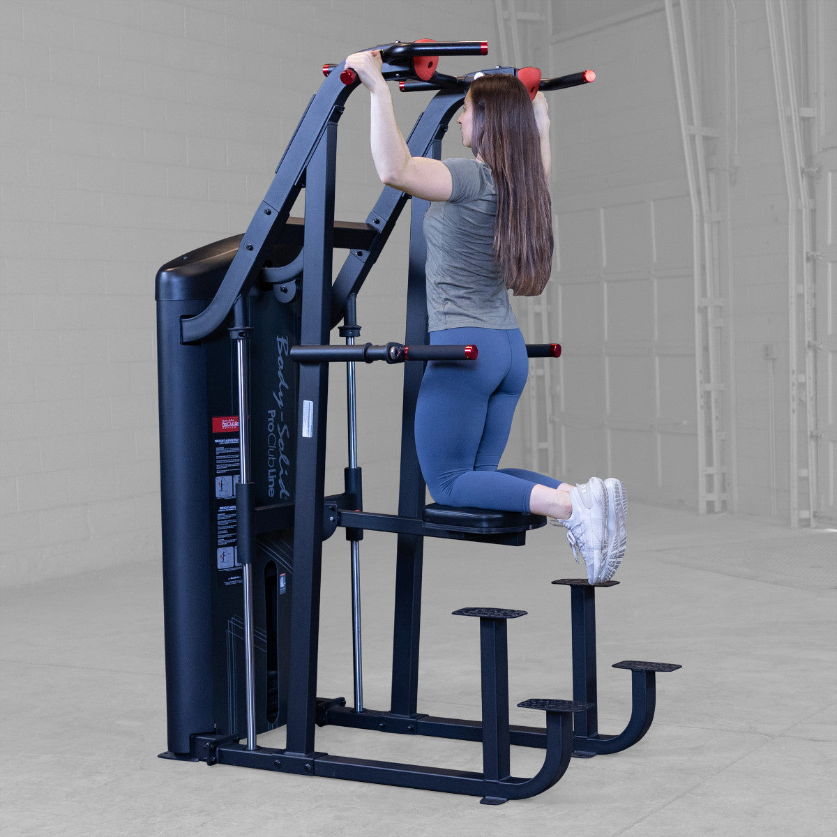 Body-Solid S2ACDX/2 Pro ClubLine Series 2 Weight Assisted Chin & Dip Machine woman exercising