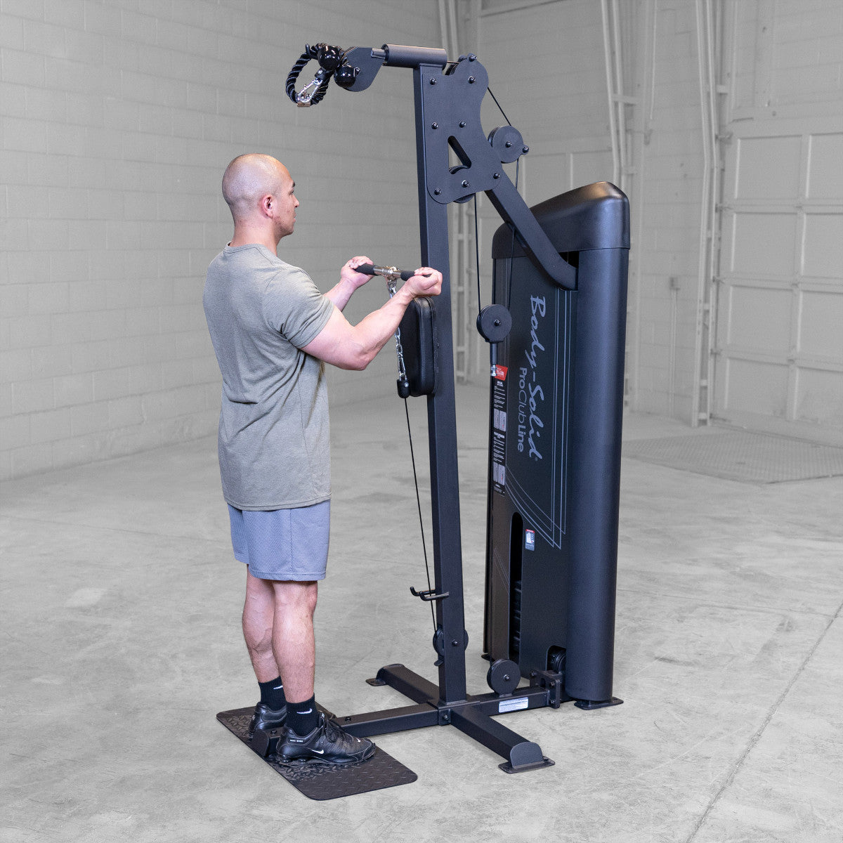 Body-Solid S2BTPX Pro ClubLine Series 2 Dual Bicep & Triceps Machine in gym with man exercising