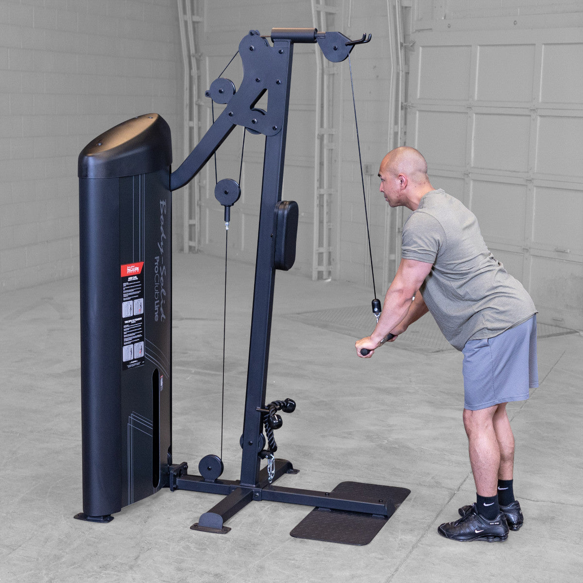 Body-Solid S2BTPX Pro ClubLine Series 2 Dual Bicep & Triceps Machine in gym with man exercising