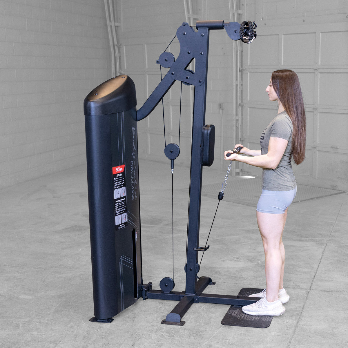 Body-Solid S2BTPX Pro ClubLine Series 2 Dual Bicep & Triceps Machine in gym with woman exercising