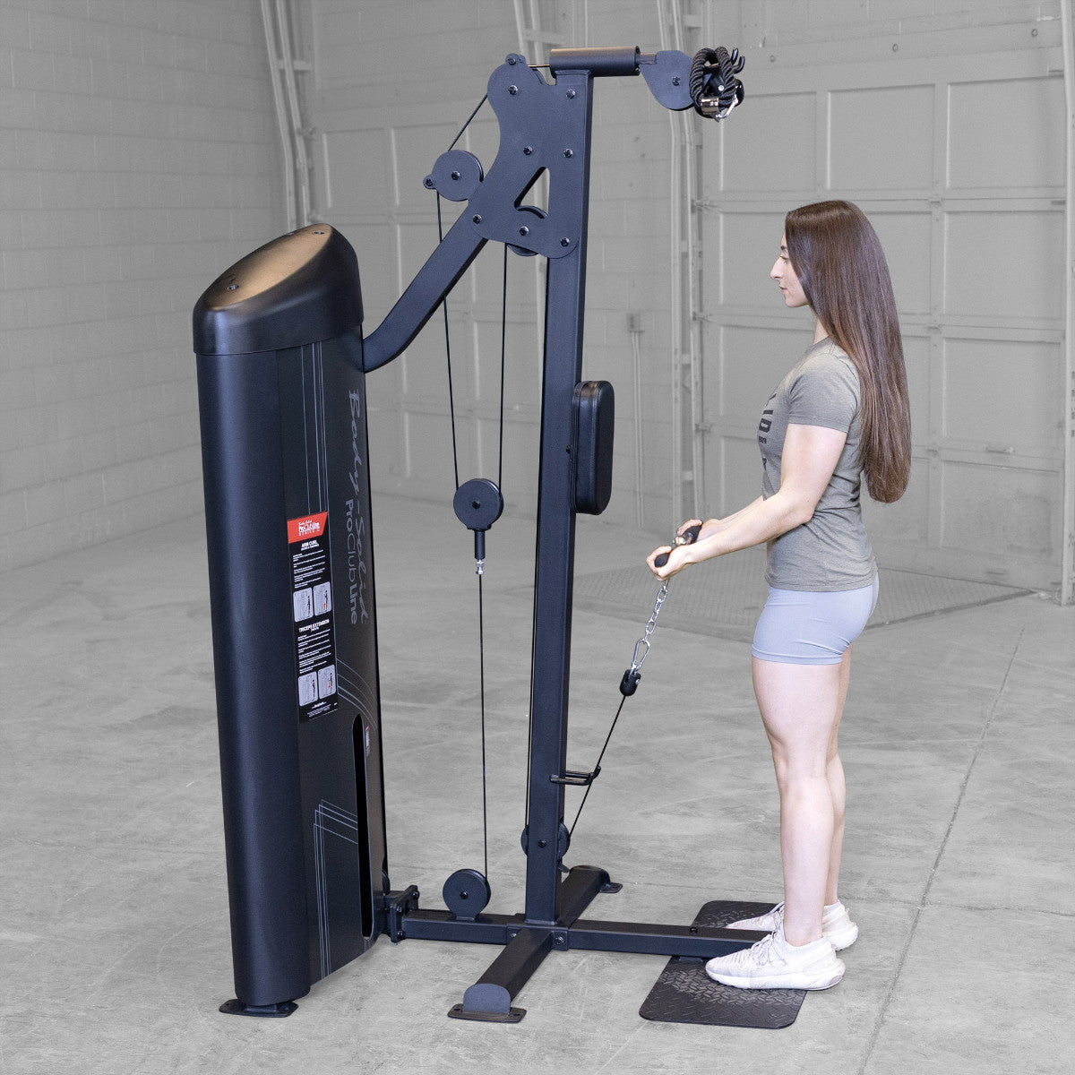 Body-Solid S2BTPX Pro ClubLine Series 2 Dual Bicep & Triceps Machine in gym with woman exercising
