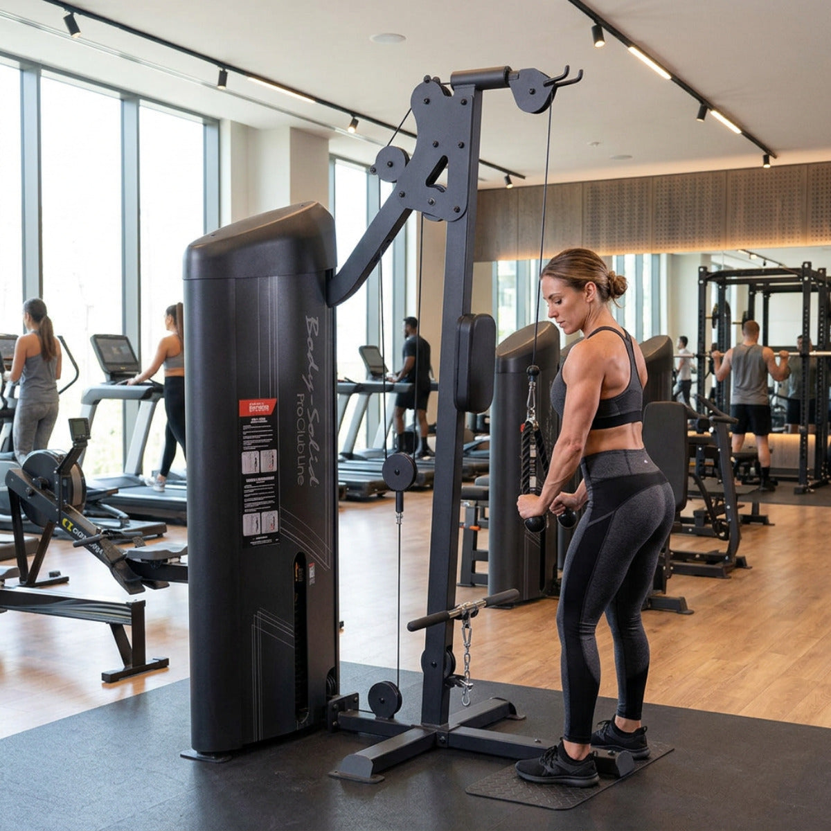 Body-Solid S2BTPX Pro ClubLine Series 2 Dual Bicep & Triceps Machine in gym with woman exercising