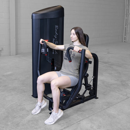 Body-Solid S2CPX Pro ClubLine Series 2 Chest Press Machine woman exercising in gym