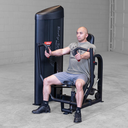 Body-Solid S2CPX Pro ClubLine Series 2 Chest Press Machine woman exercising in gym