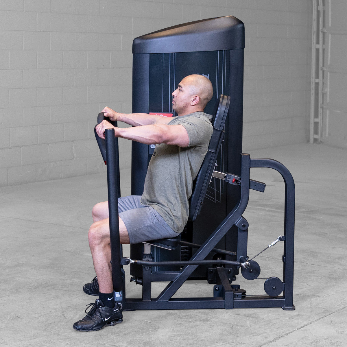 Body-Solid S2CPX Pro ClubLine Series 2 Chest Press Machine woman exercising in gym
