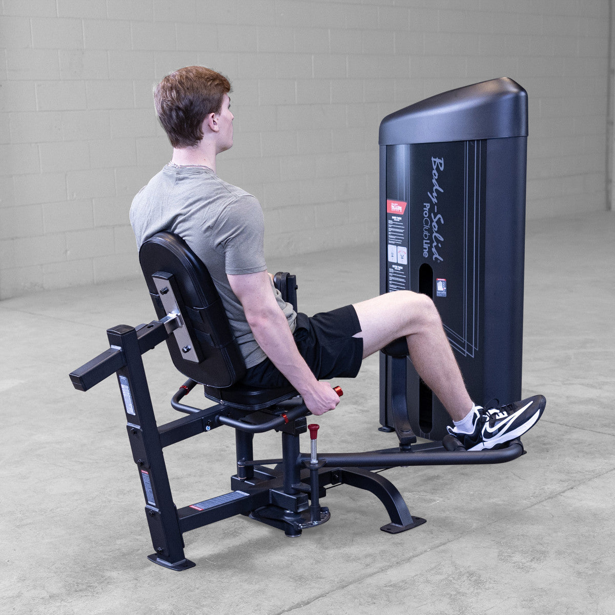 Body-Solid S2IOTX Pro ClubLine Series 2 Dual Inner Outer Thigh Machine in gym with man exercising