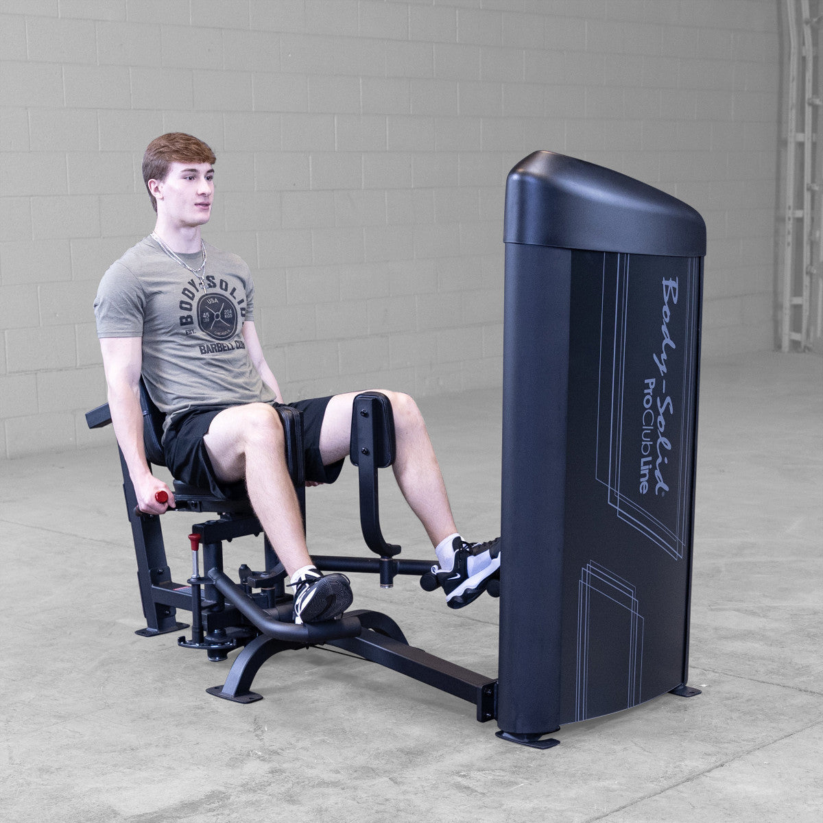 Body-Solid S2IOTX Pro ClubLine Series 2 Dual Inner Outer Thigh Machine in gym with man exercising