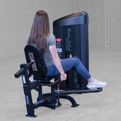 Body-Solid S2IOTX Pro ClubLine Series 2 Dual Inner Outer Thigh Machine in gym with woman exercising