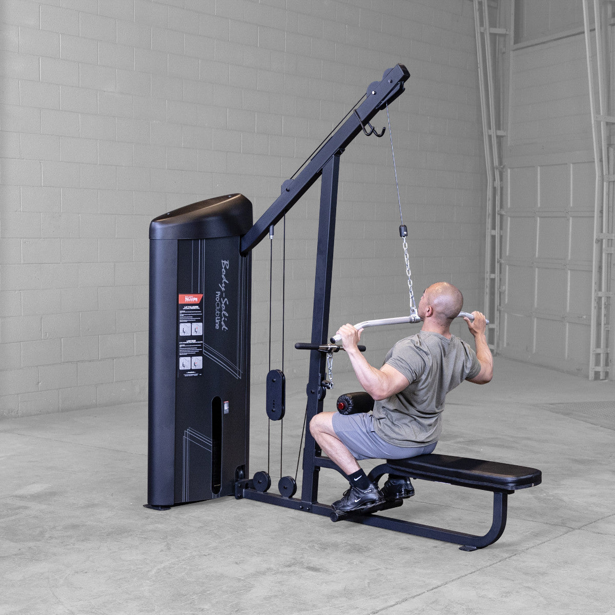 Body-Solid S2LATX Pro ClubLine Series 2 Dual Lat & Seated Row Machine with man exercising
